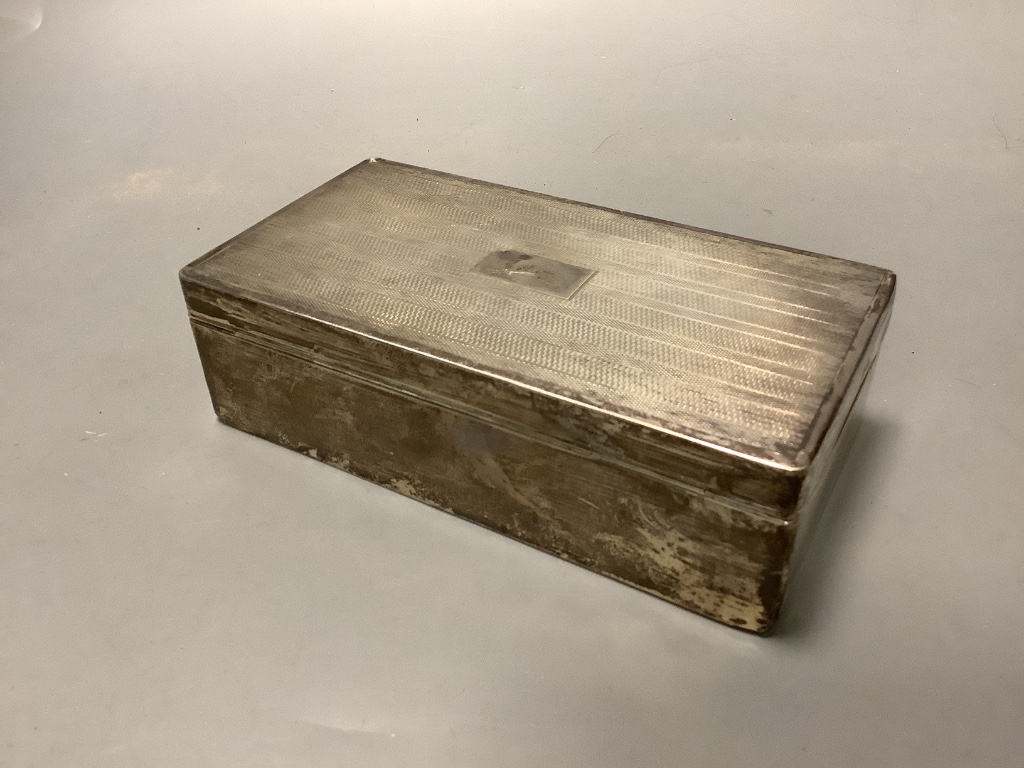 A George V engine turned silver rectangular cigarette box, Birmingham 1928,17.3 cm.